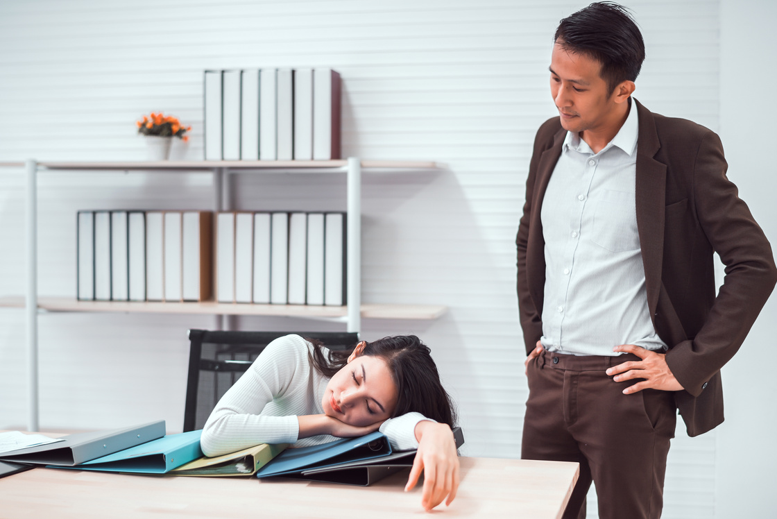 Boss caught tired lazy employee sleeping at workplace, business, overwork at office concept.